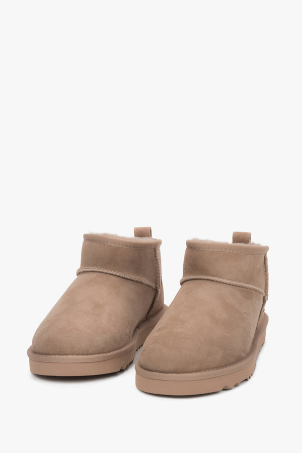 Beige velour snow boots with a furry interior — warmth and style in one.