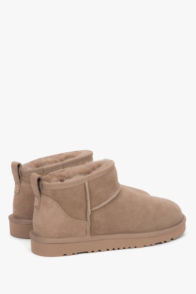 Soft beige snow boots made of genuine velour with cozy fur insulation.