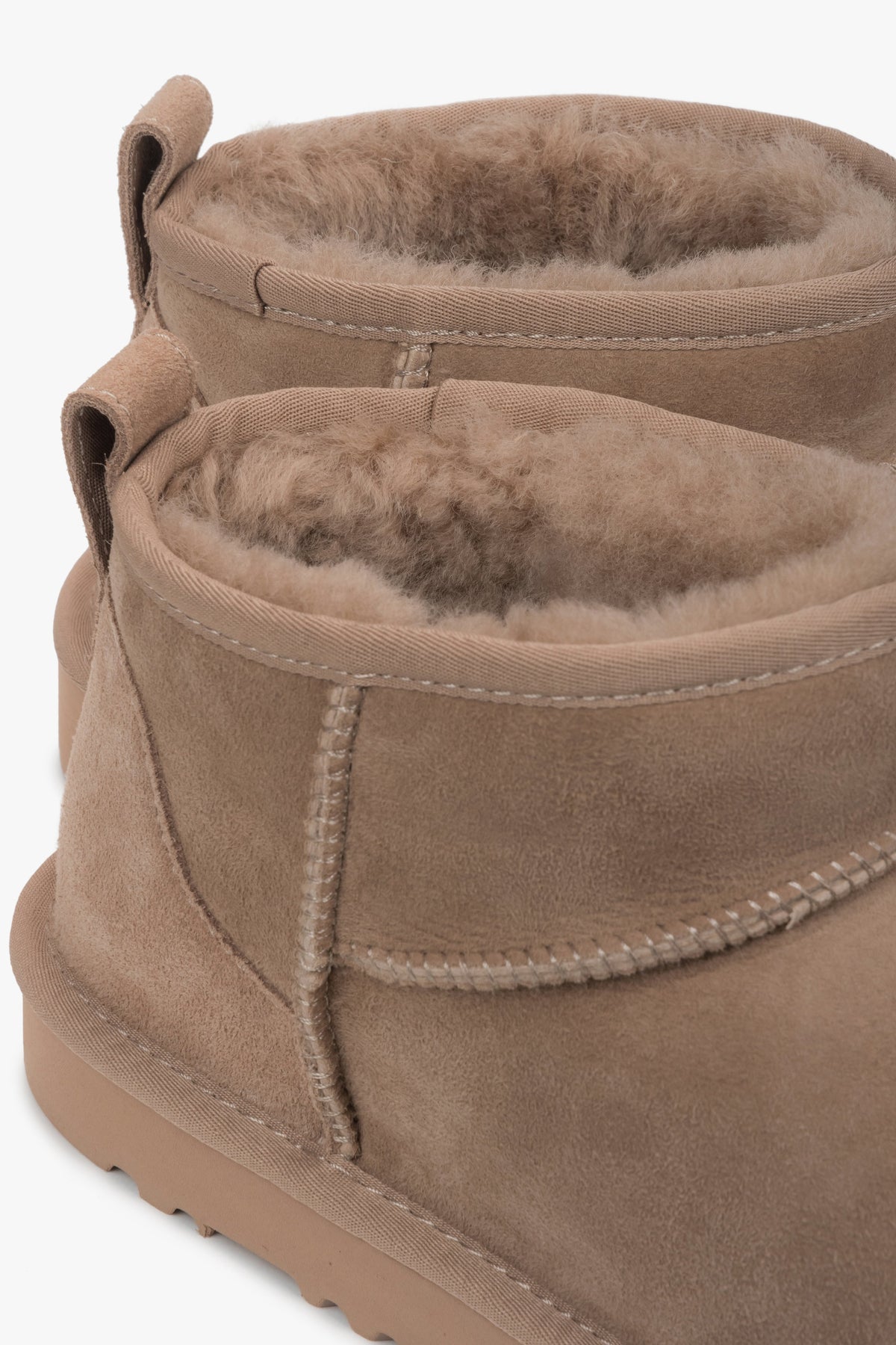 Women’s Estro snow boots made of beige genuine velour with a fur lining.