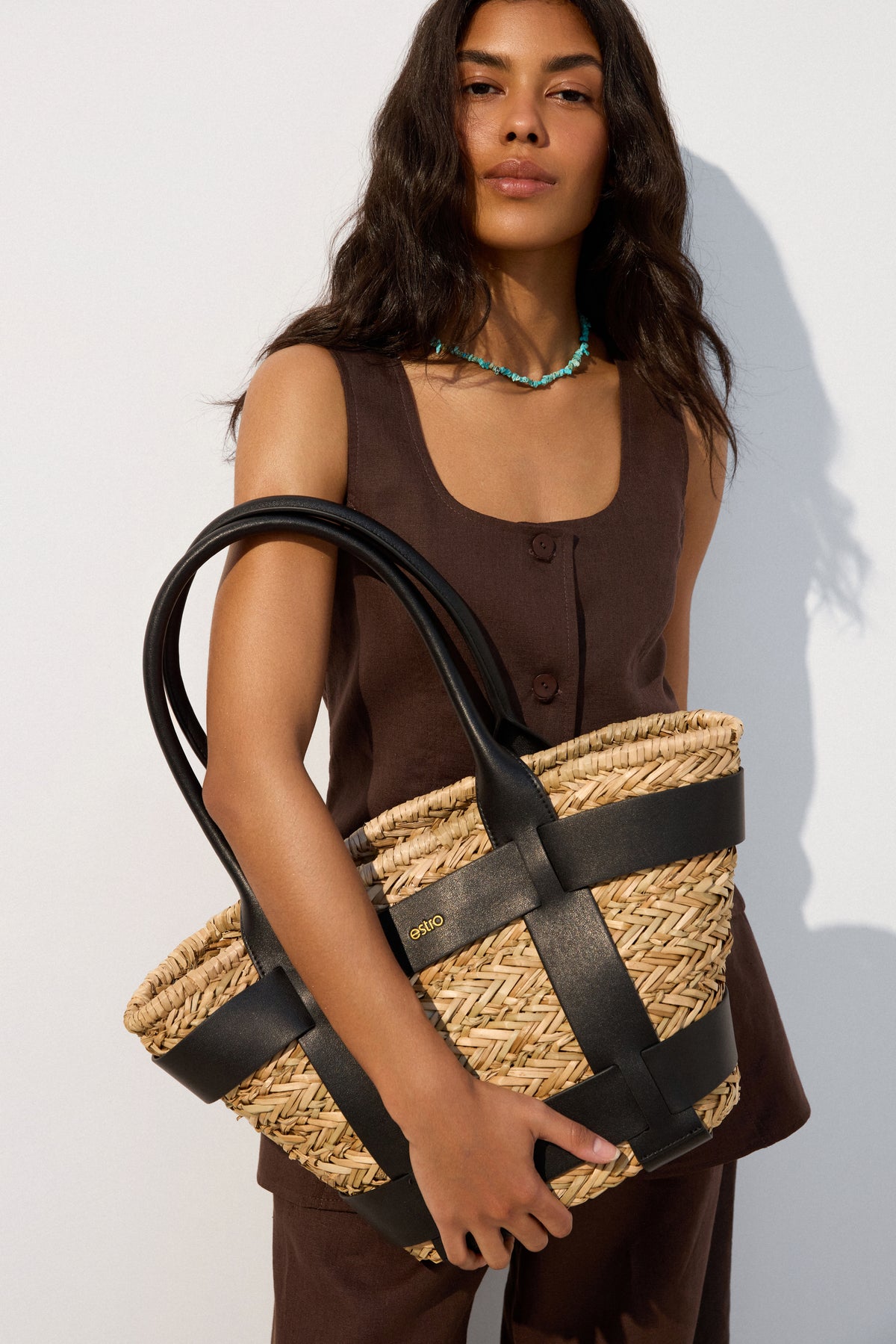 Basket-type shopper bag in beige and black tones - presentation in full styling.