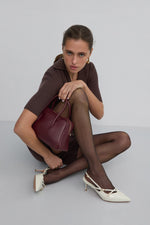 Elegant light beige women's slingback pumps by Estro, crafted from glossy patent genuine leather in a timeless silhouette - – on-foot presentation.