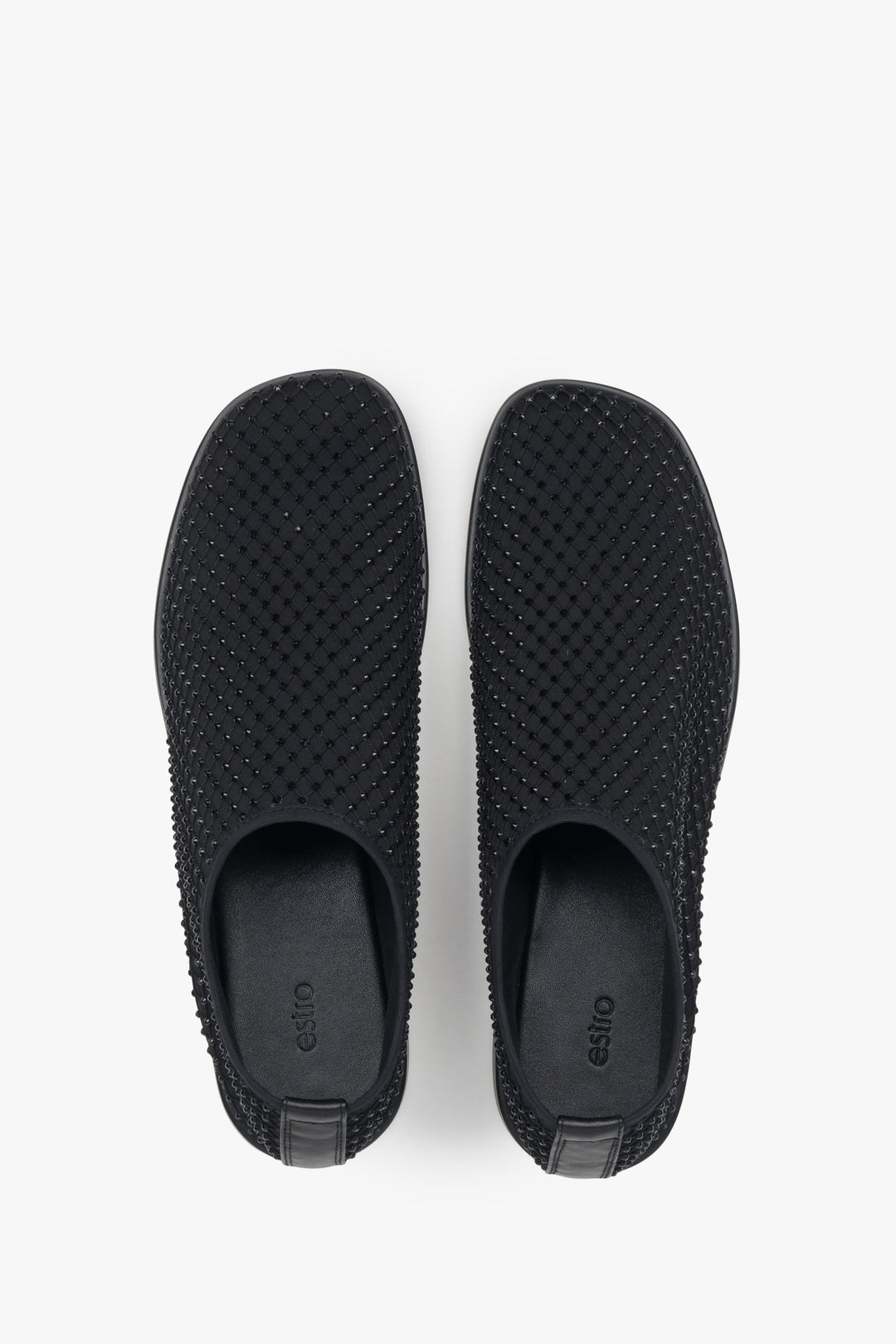 Unique black flats for women by Estro, featuring a combination of breathable mesh and shimmering rhinestones.