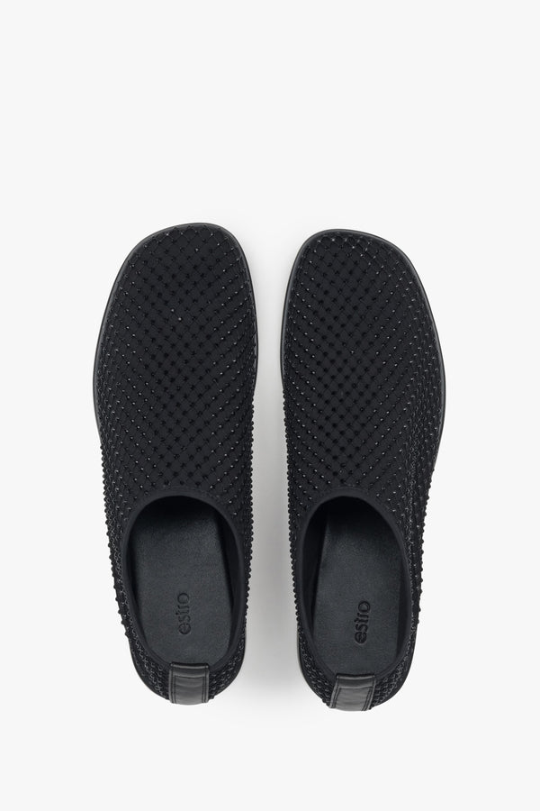 Unique black flats for women by Estro, featuring a combination of breathable mesh and shimmering rhinestones.