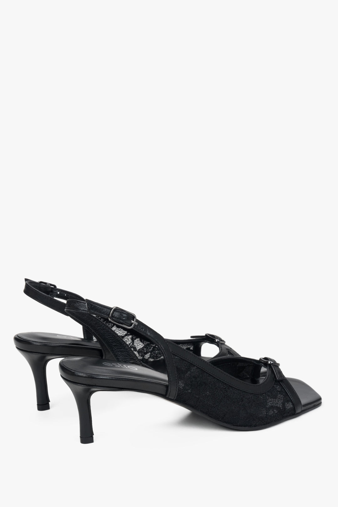 Black slingback heeled sandals with decorative lace.
