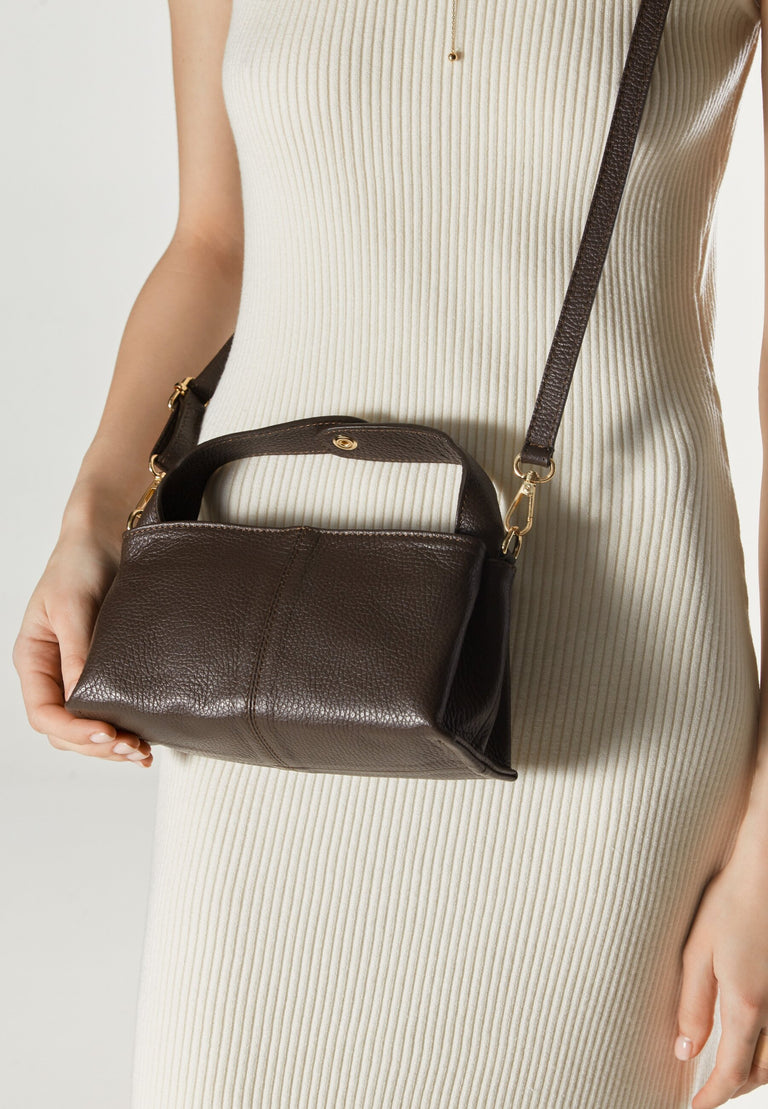 Women's dark brown handbag by Estro - presented on a model.