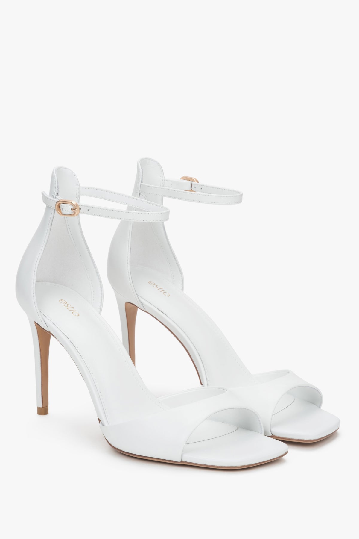 Women's refined white sandals Estro, made of luxurious genuine leather, set on a sleek high heel.