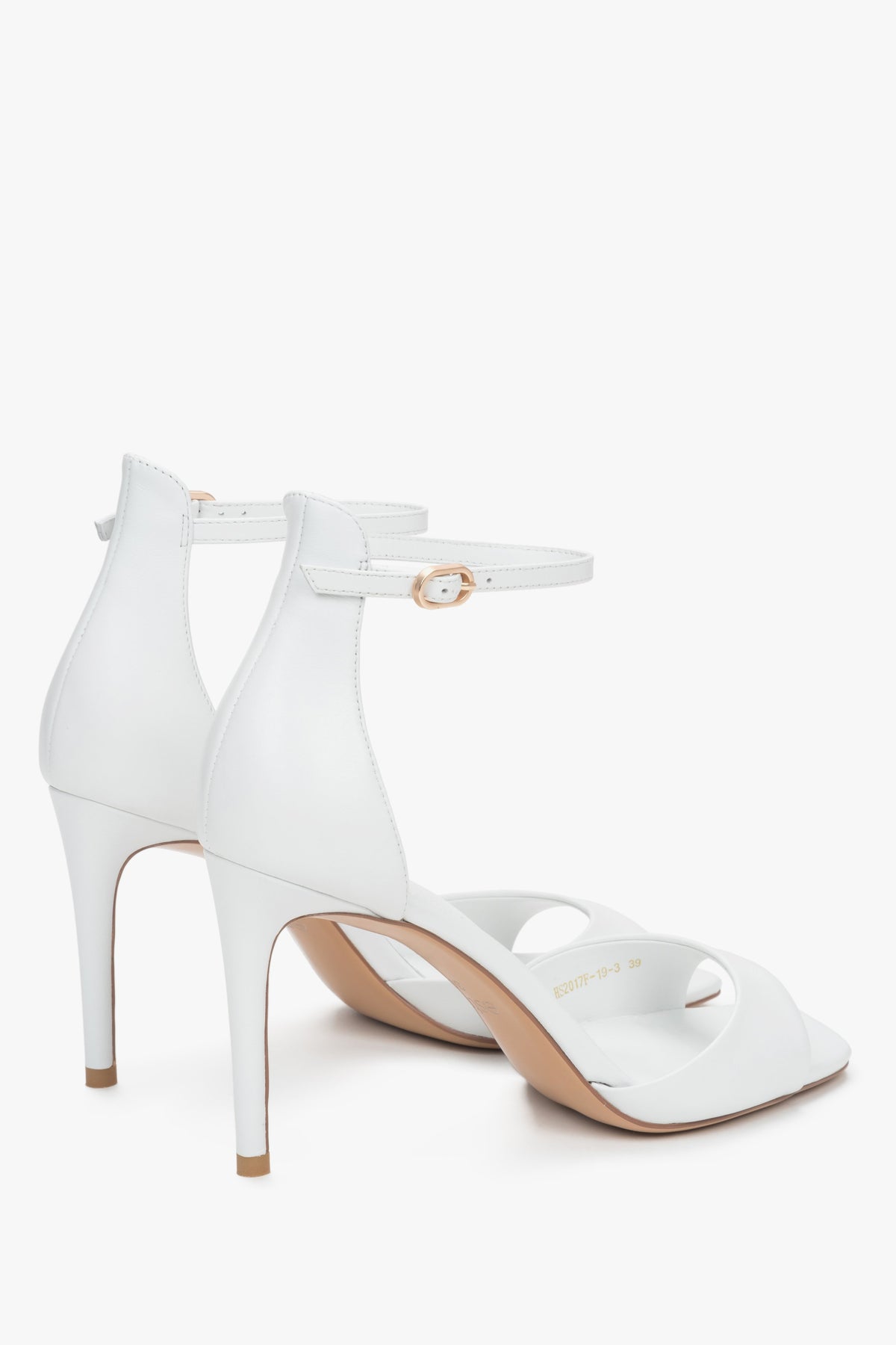 Women's versatile white sandals Estro made of genuine leather and set on a high heel.