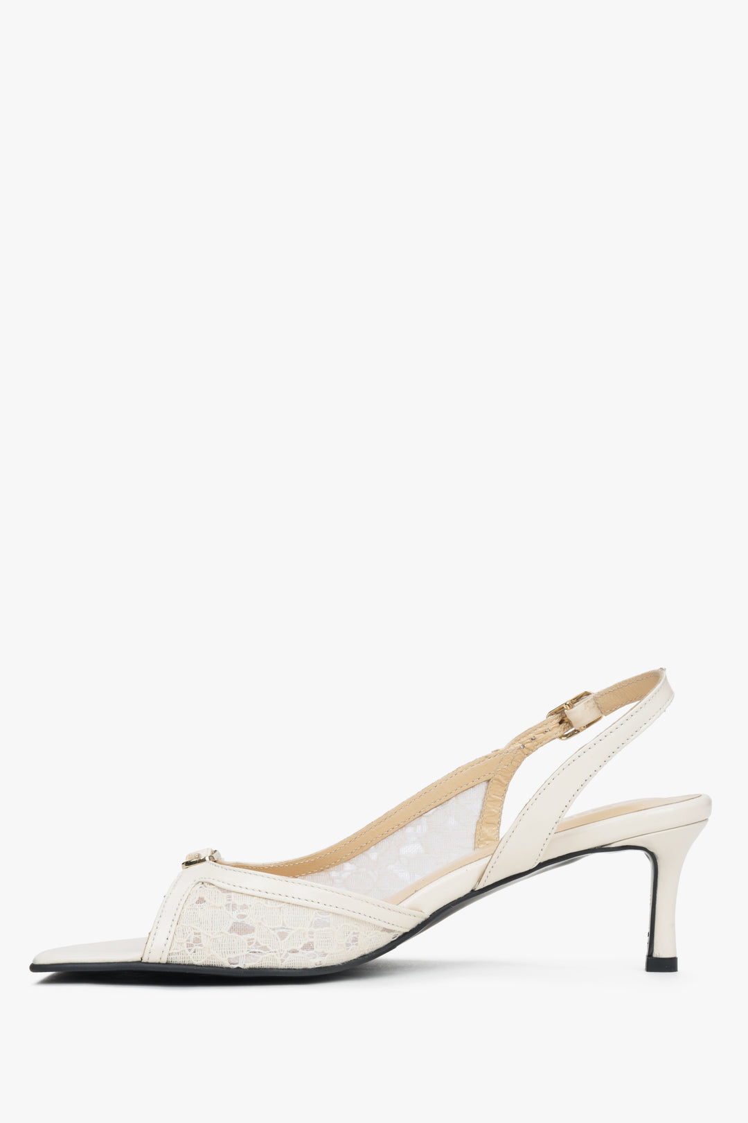 White heeled women's sandals with lace detailing.