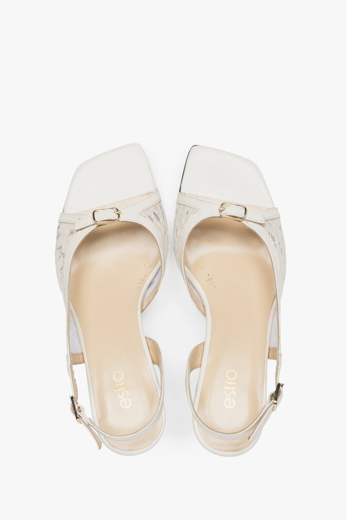 Stylish white slingback sandals with lace detailing.
