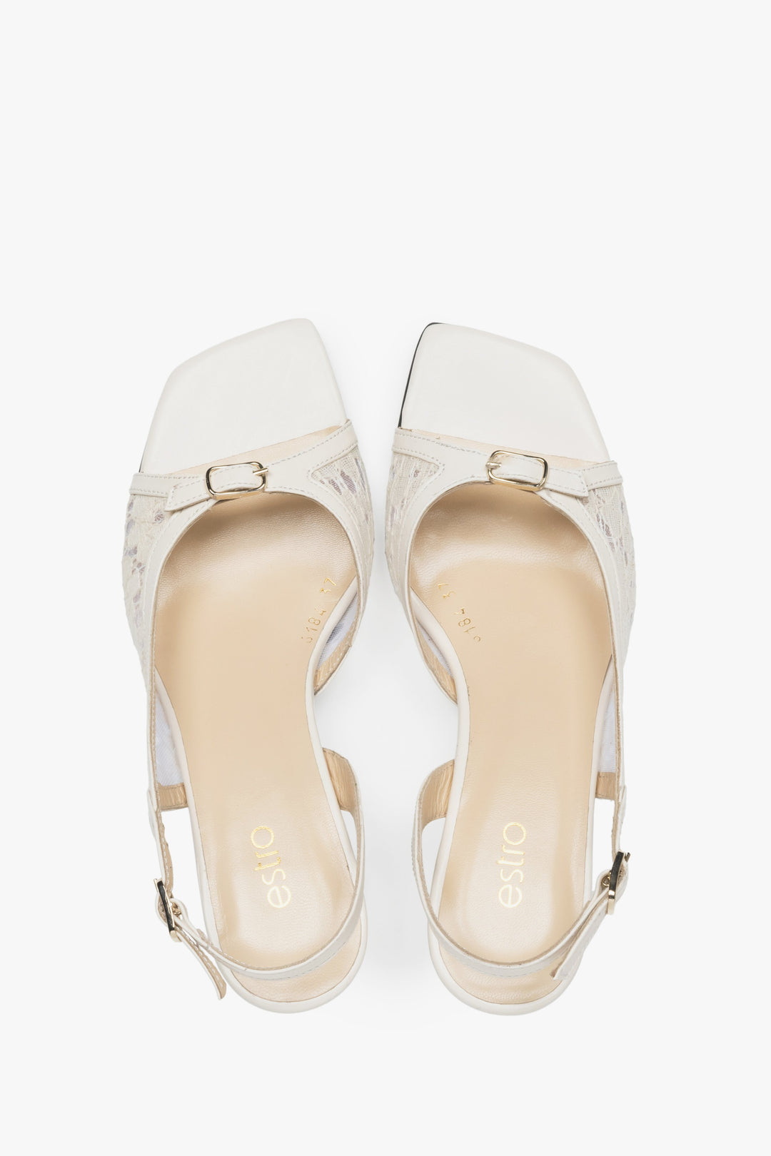 Stylish white slingback sandals with lace detailing.
