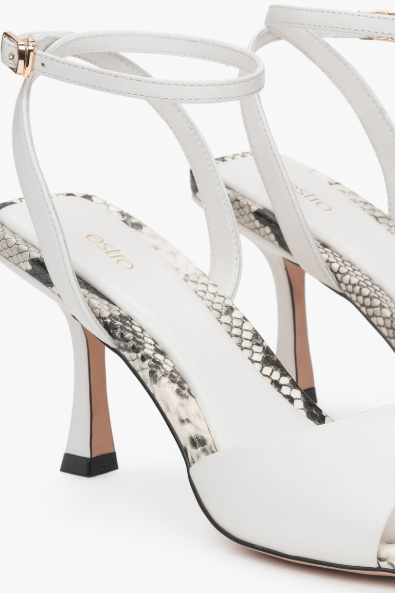Light beige leather women's sandals by Estro – animal pattern details.