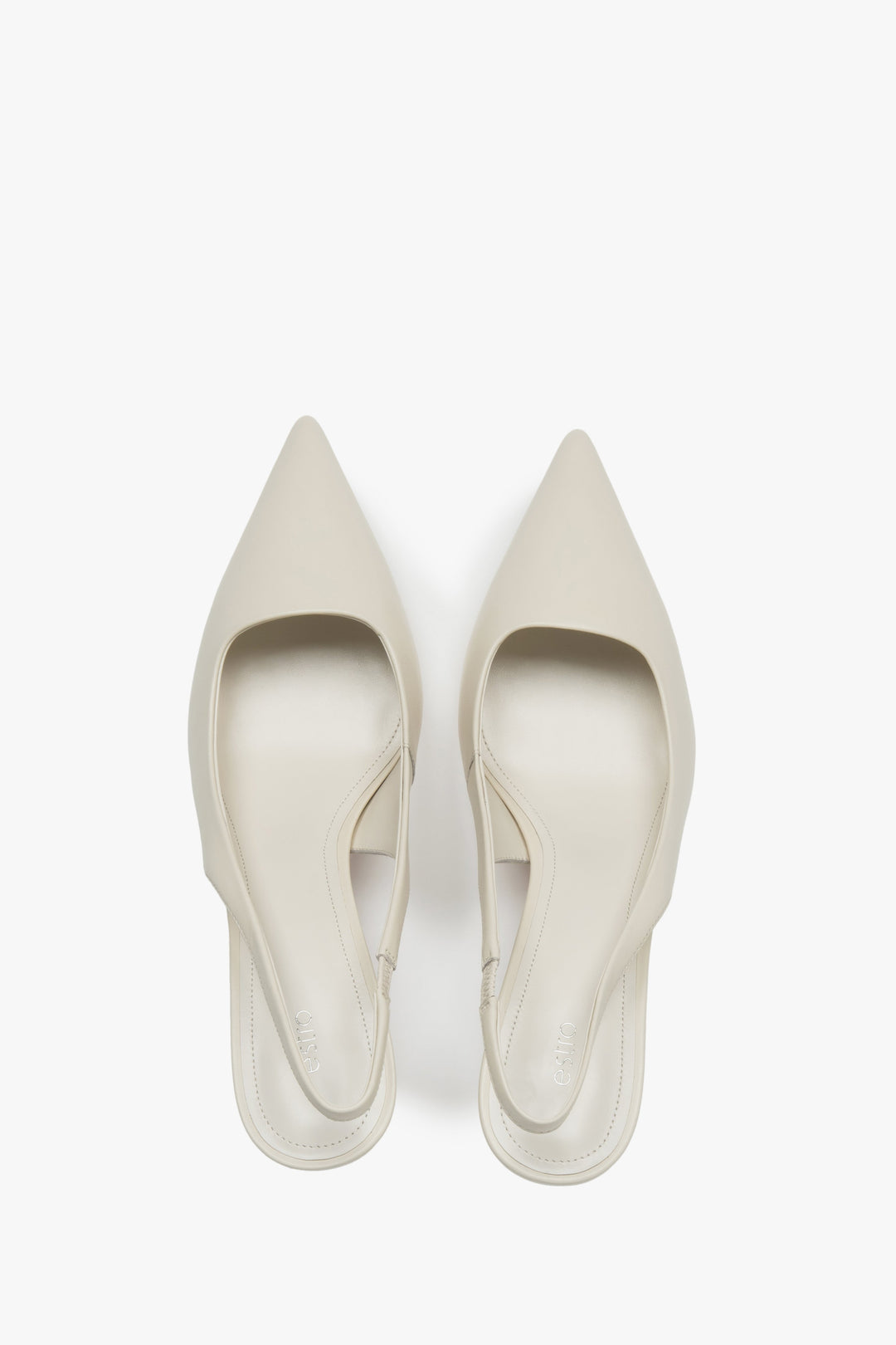 Light beige slingback pumps by Estro with a slimming high heel – top view presentation.