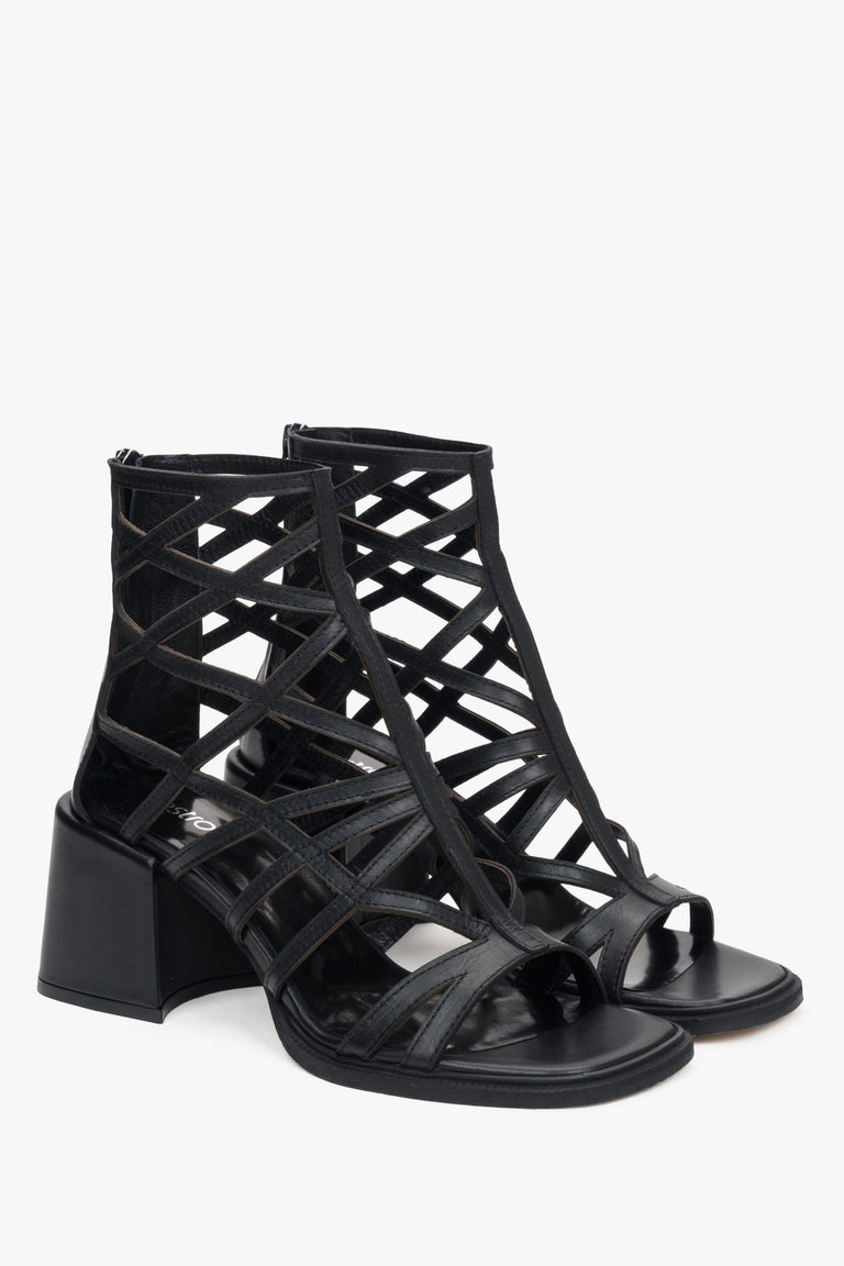 Stylish black perforated women's heeled sandals by Estro, inspired by the gladiator style.