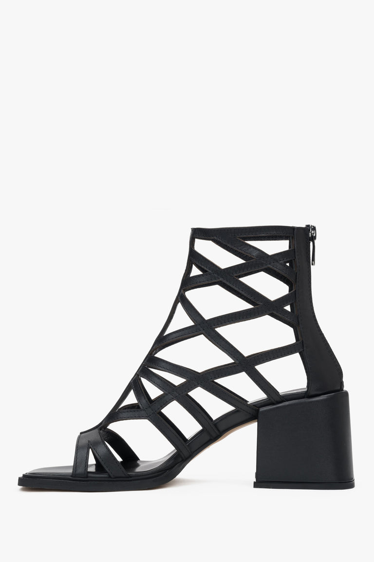 Black perforated gladiator-style heeled sandals by Estro – bold and stylish women's footwear.