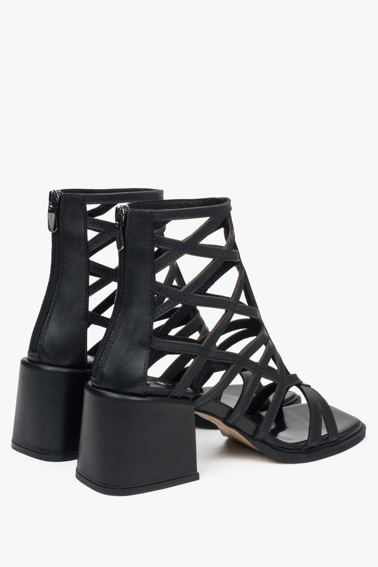 Elegant black women's heeled sandals by Estro, featuring a perforated design and a gladiator-inspired silhouette.