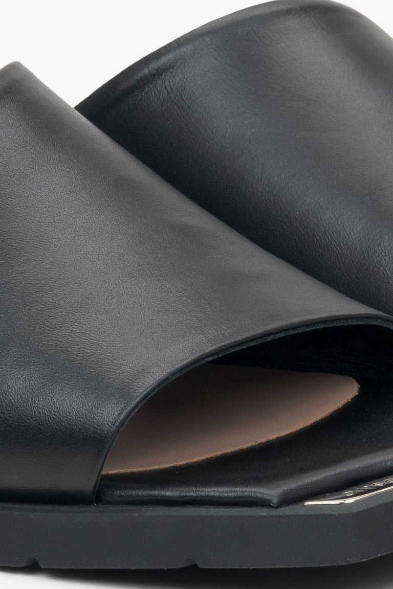 Women's black leather mules by Estro – close-up details.