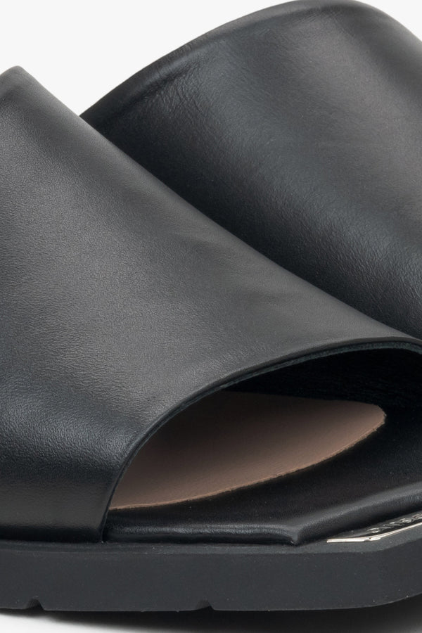 Women's black leather mules by Estro – close-up details.