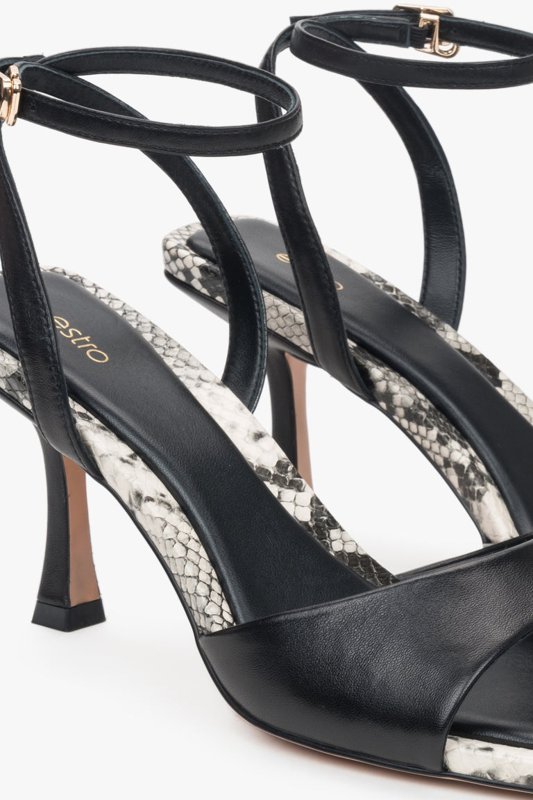 Black leather women's sandals by Estro – animal pattern details.
