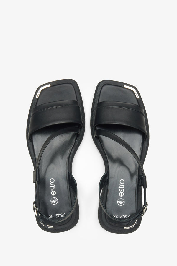 Black leather sandals by Estro, designed for comfort with a specially contoured sole.