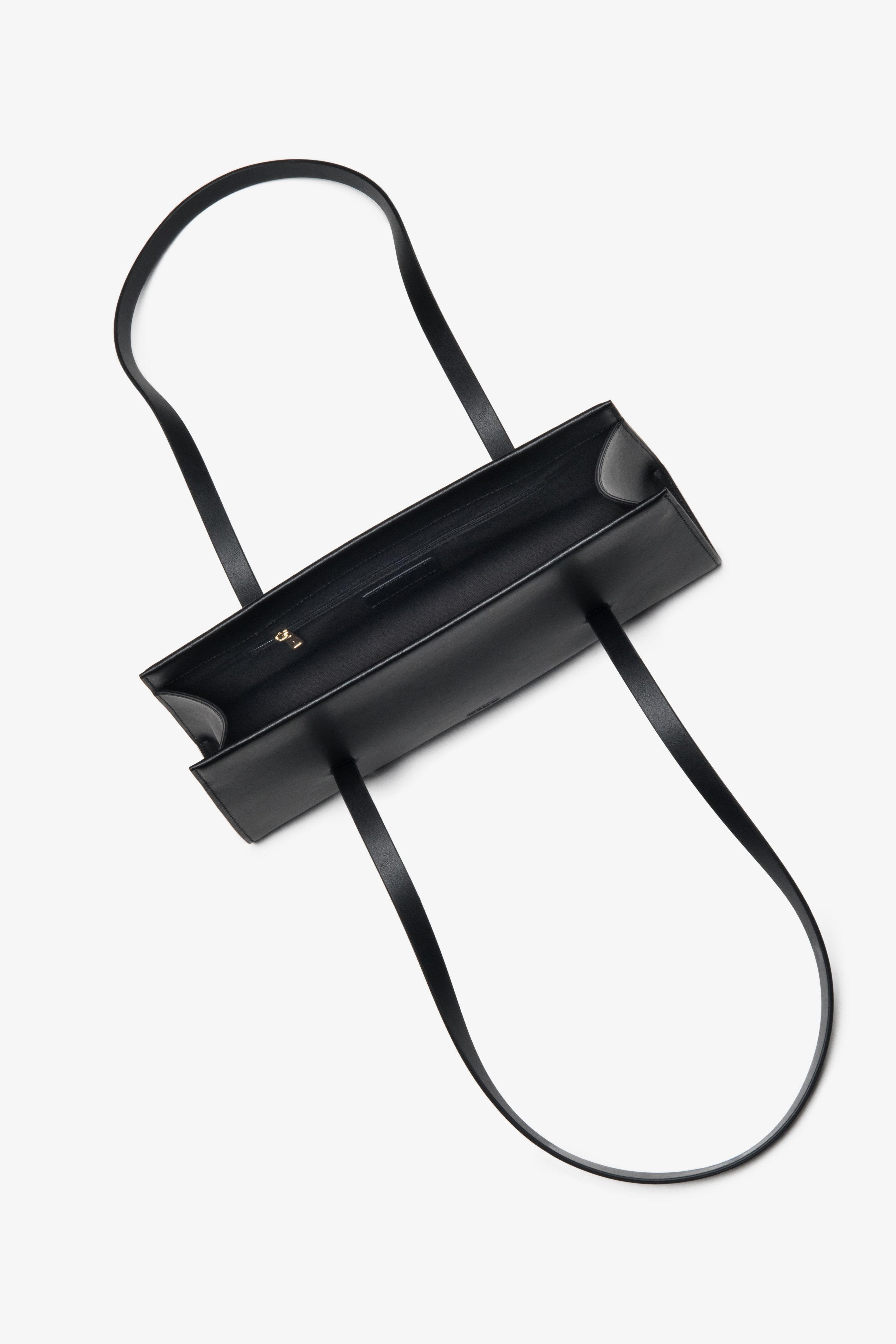 Practical and stylish black women's handbag by Estro, made of natural leather and featuring long handles for easy shoulder wear.