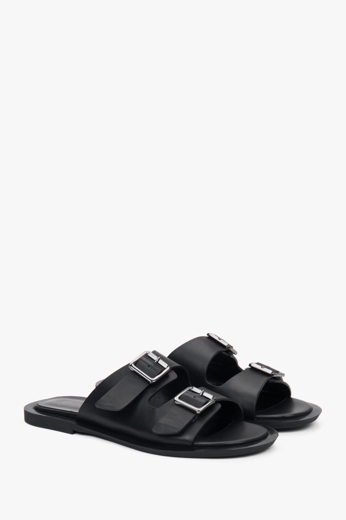 Minimalist black women's leather slides by Estro, featuring two distinctive straps.
