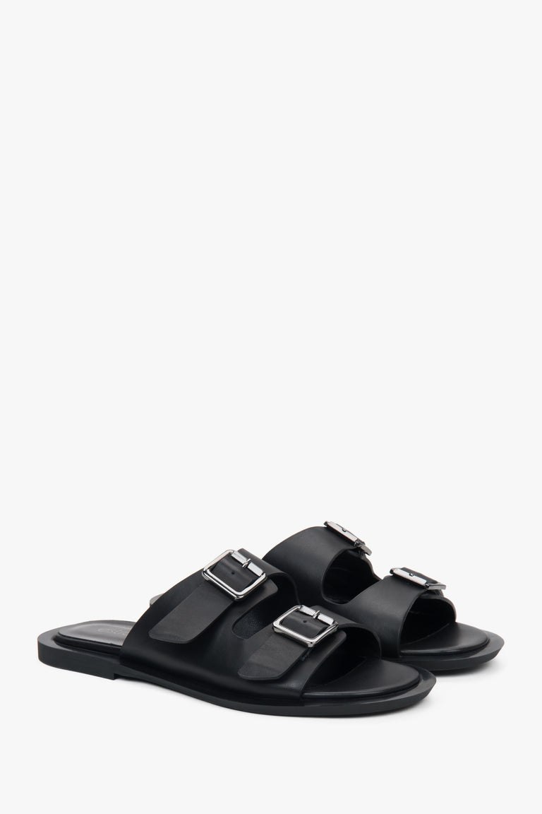 Minimalist black women's leather slides by Estro, featuring two distinctive straps.