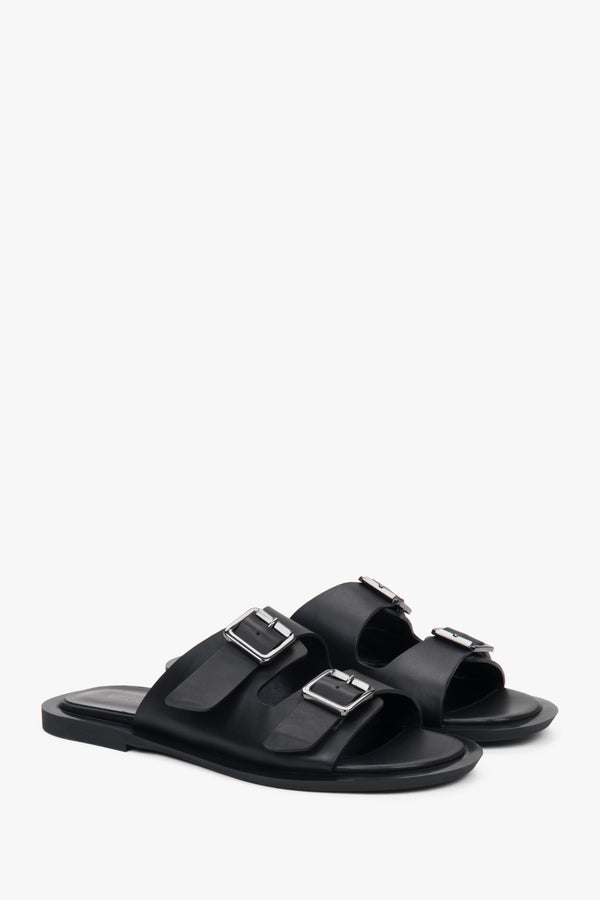 Minimalist black women's leather slides by Estro, featuring two distinctive straps.