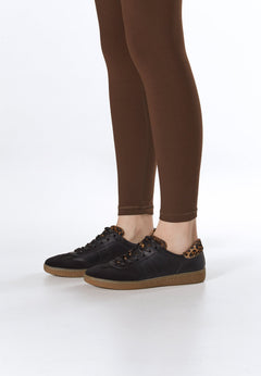 Estro women's black leather sneakers – on-foot presentation.