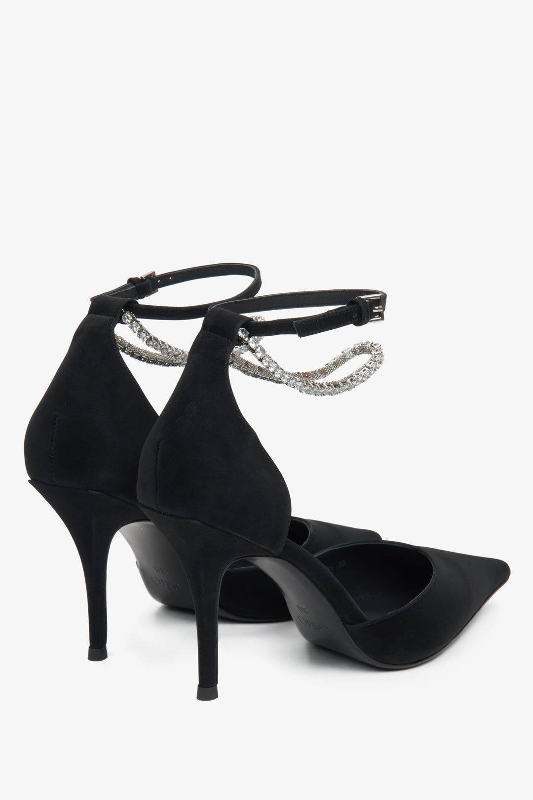 Women's pointed pumps with sparkling crystals and textured leather – close-up of the heel counter.