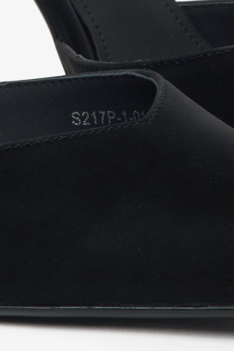 Black pumps on a heel by Estro with crystals and textured finish – close-up of the details.