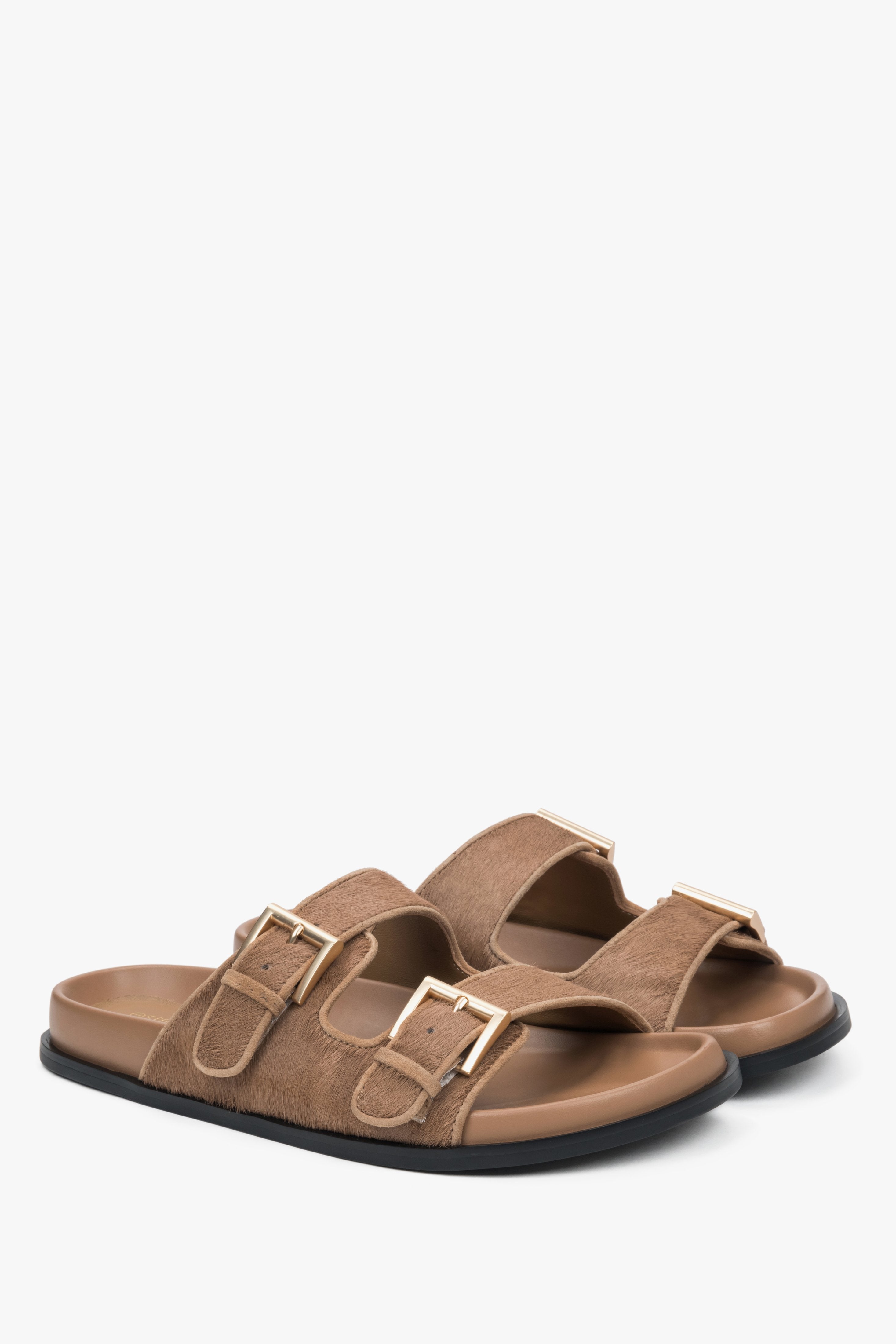 Comfortable brown women's slides by Estro, made of natural leather, with wide adjustable straps for a perfect fit.