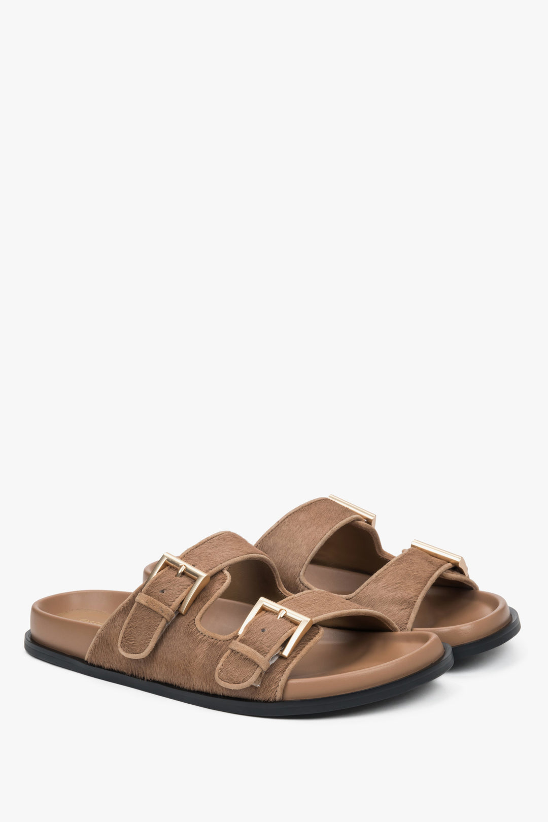 Comfortable brown women's slides by Estro, made of natural leather, with wide adjustable straps for a perfect fit.