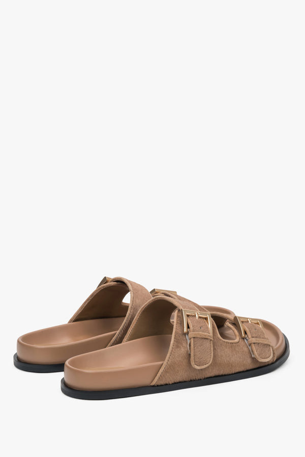 Comfortable brown women's slides by Estro, made of natural leather, offering maximum comfort with wide, adjustable straps.
