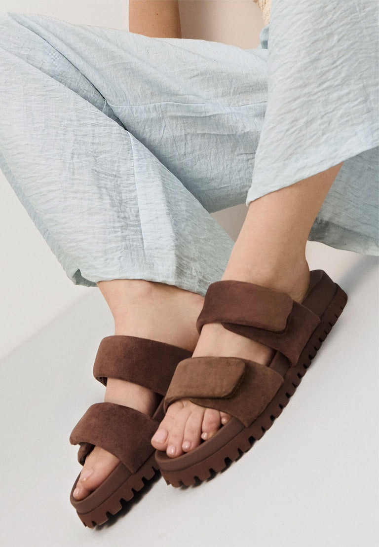 Comfortable dark brown women's slides by Estro  – on-foot presentation.