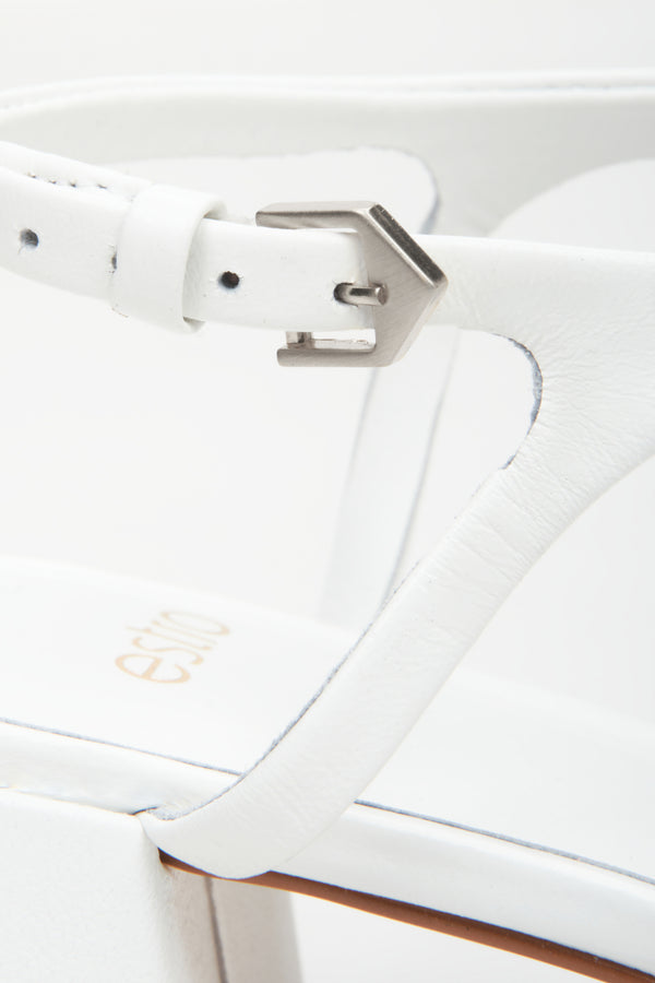 Women's white sandals made of genuine leather by Estro - close-up on details.