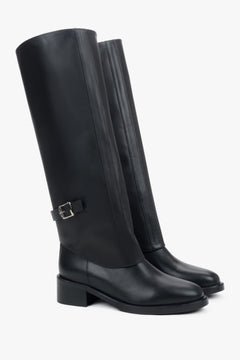 Genuine leather, women’s black 2-in-1 ankle and knee-high boots with decorative buckle by Estro.