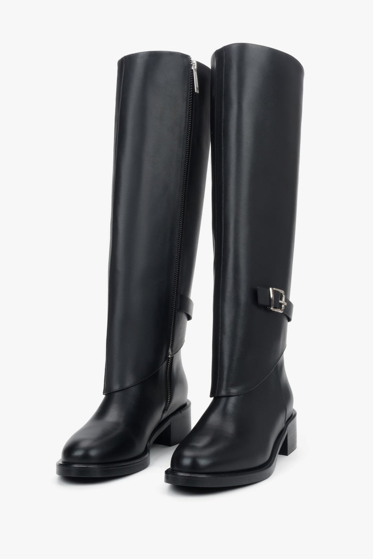 Black 2-in-1 ankle and knee-high boots in genuine leather with decorative buckle.