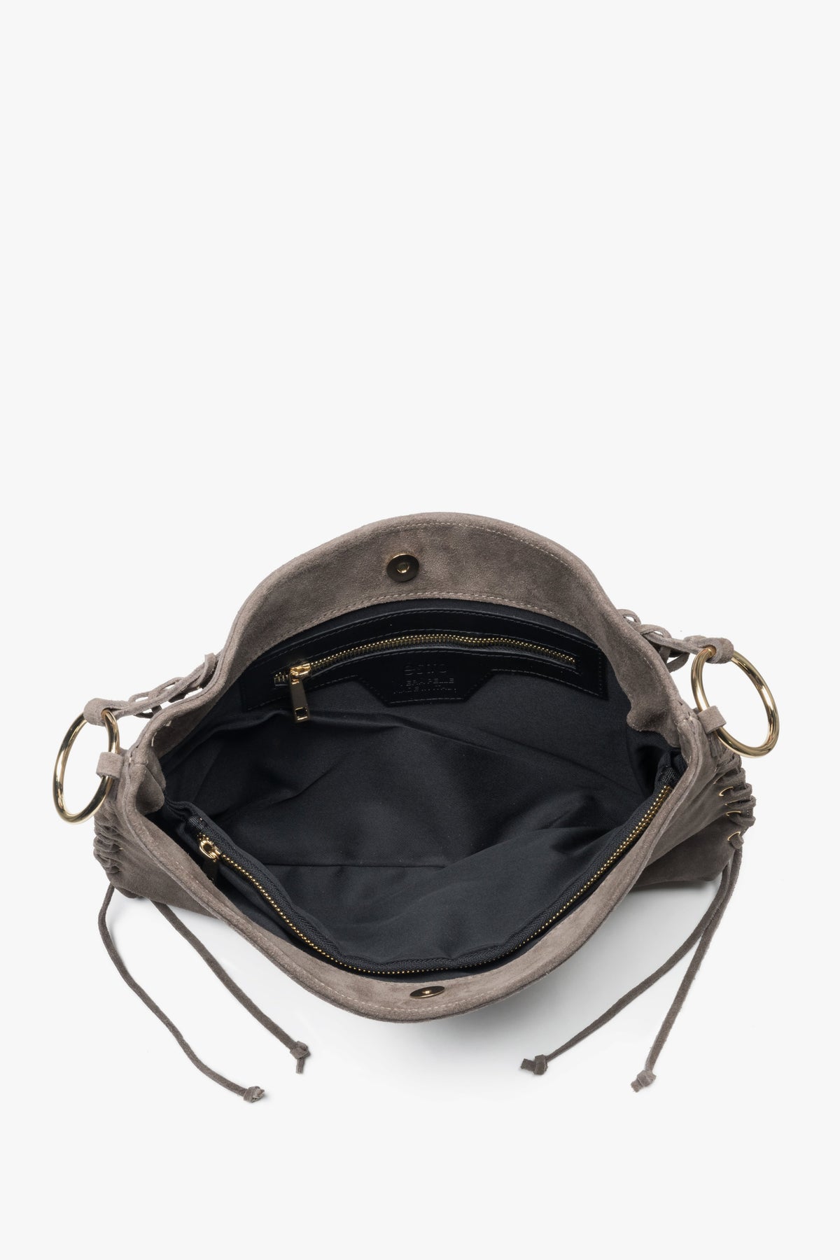The spacious interior is lined with high-quality textile, offering three compartments and one pocket for organized storage.