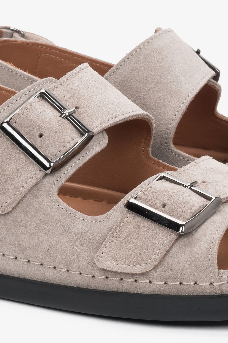 Beige women’s comfort suede sandals with adjustable straps.