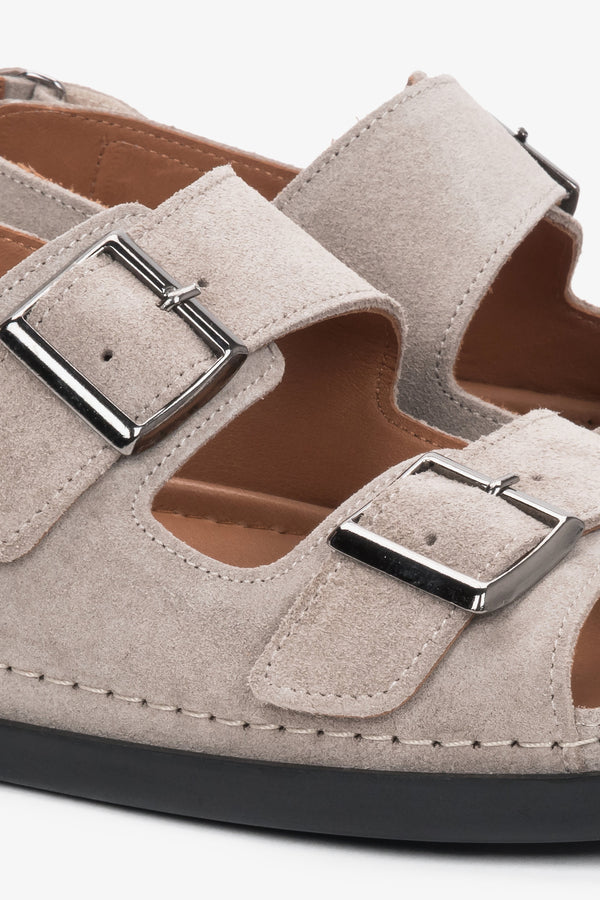 Beige women’s comfort suede sandals with adjustable straps.