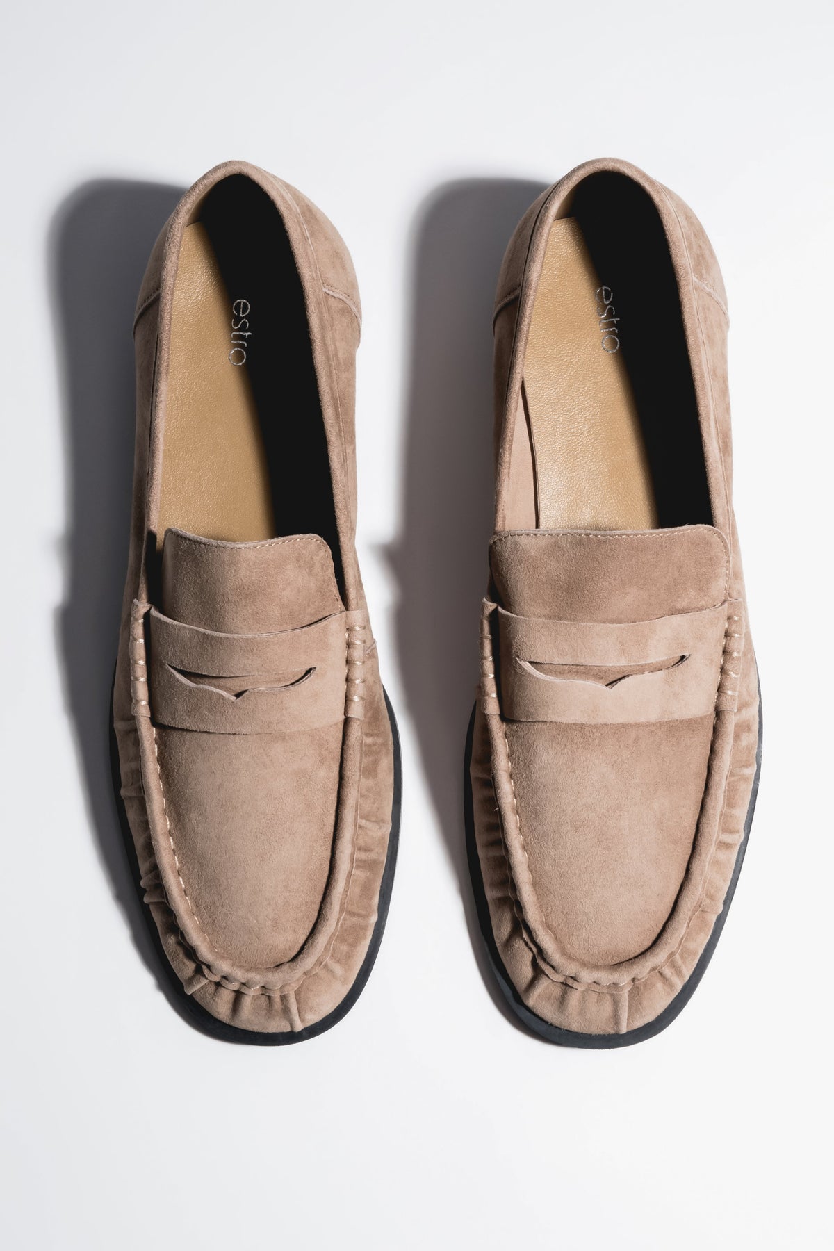 Beige women's loafers Estro, made of natural velour, with decorative stitching.