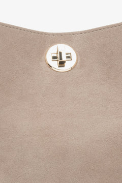 Beige women’s Estro handheld bag made of natural velour.