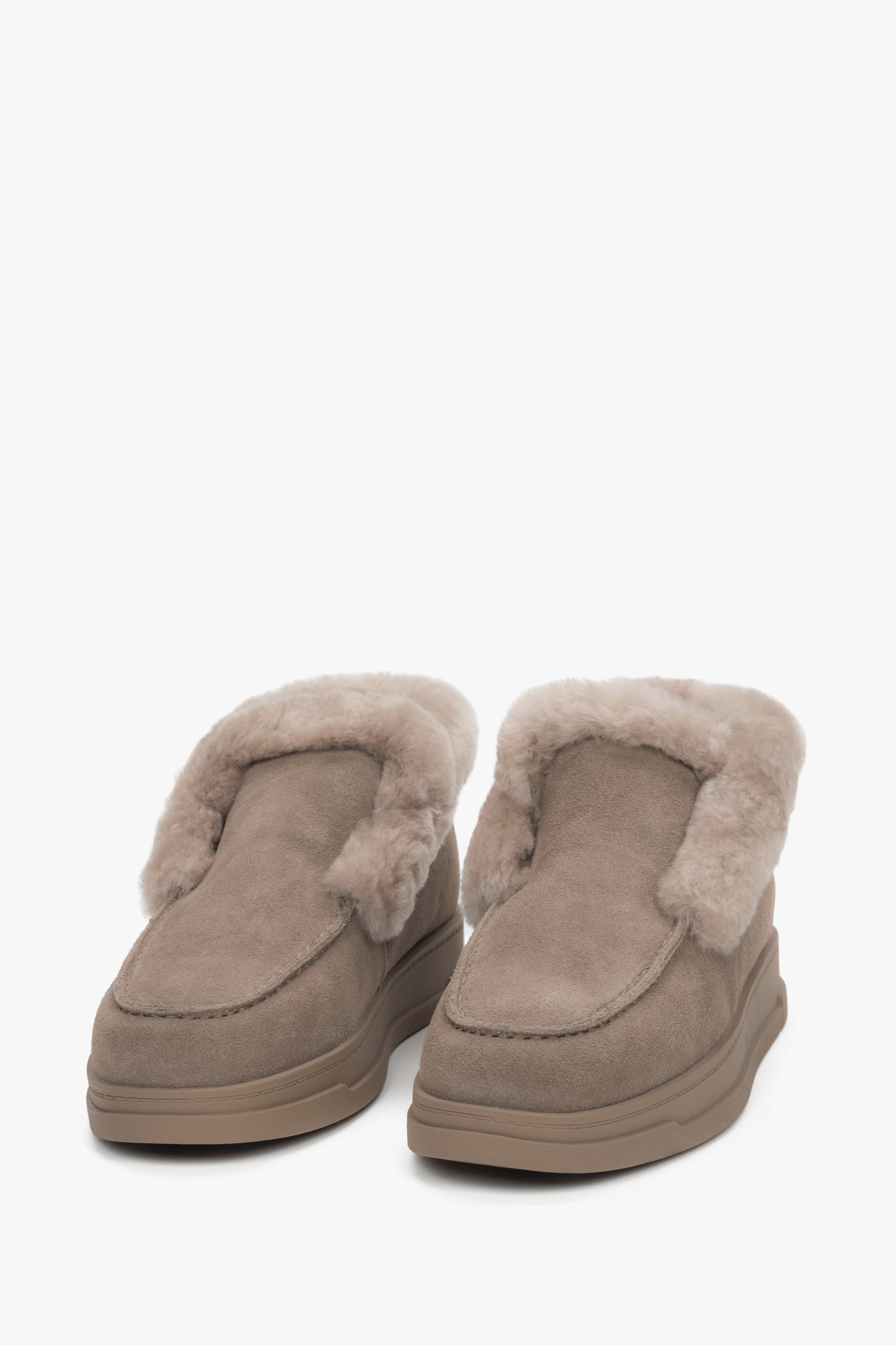 Cozy winter slip-on loafers in a soft beige shade.