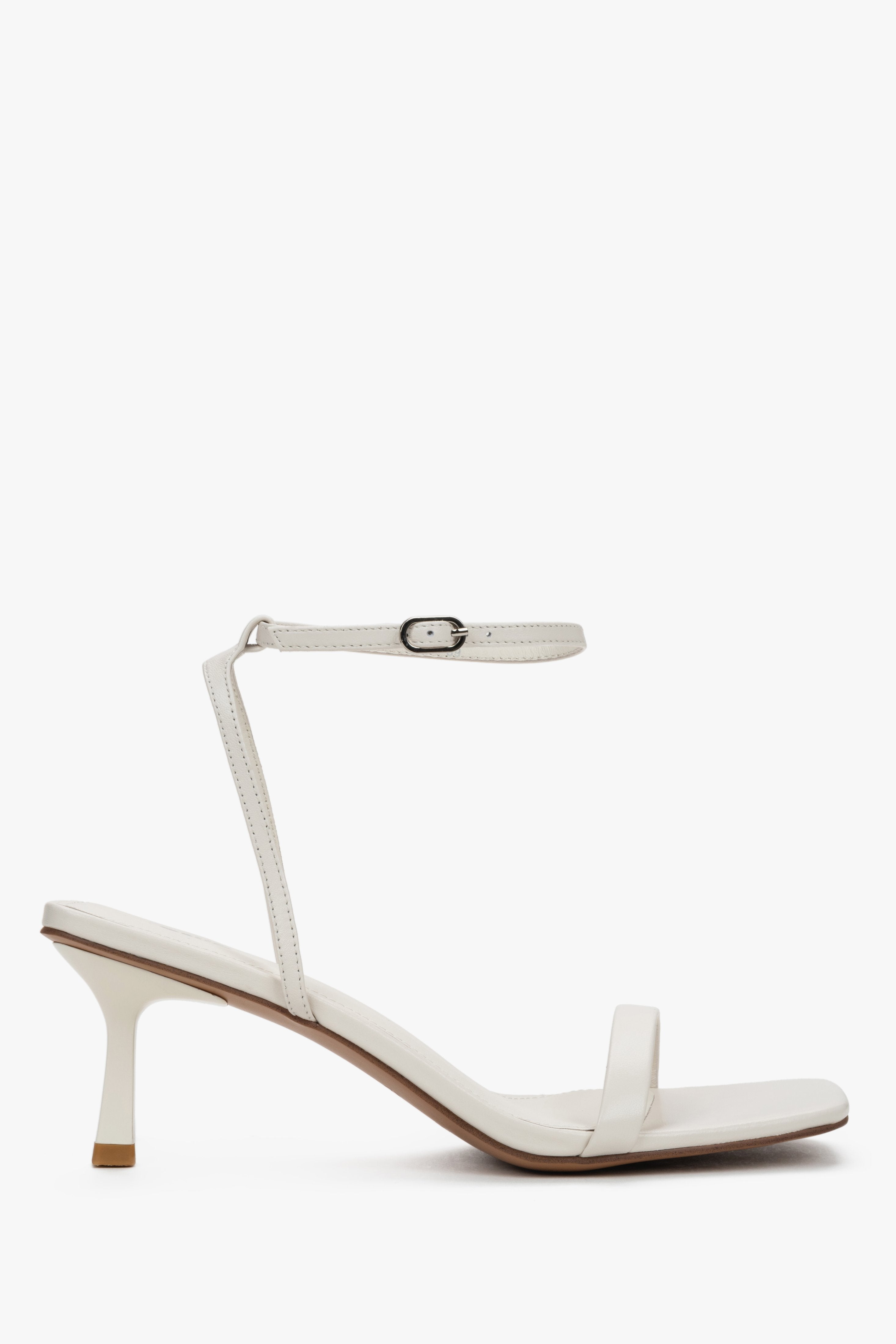 Women's beige leather funnel heel sandals by Estro with silver details.