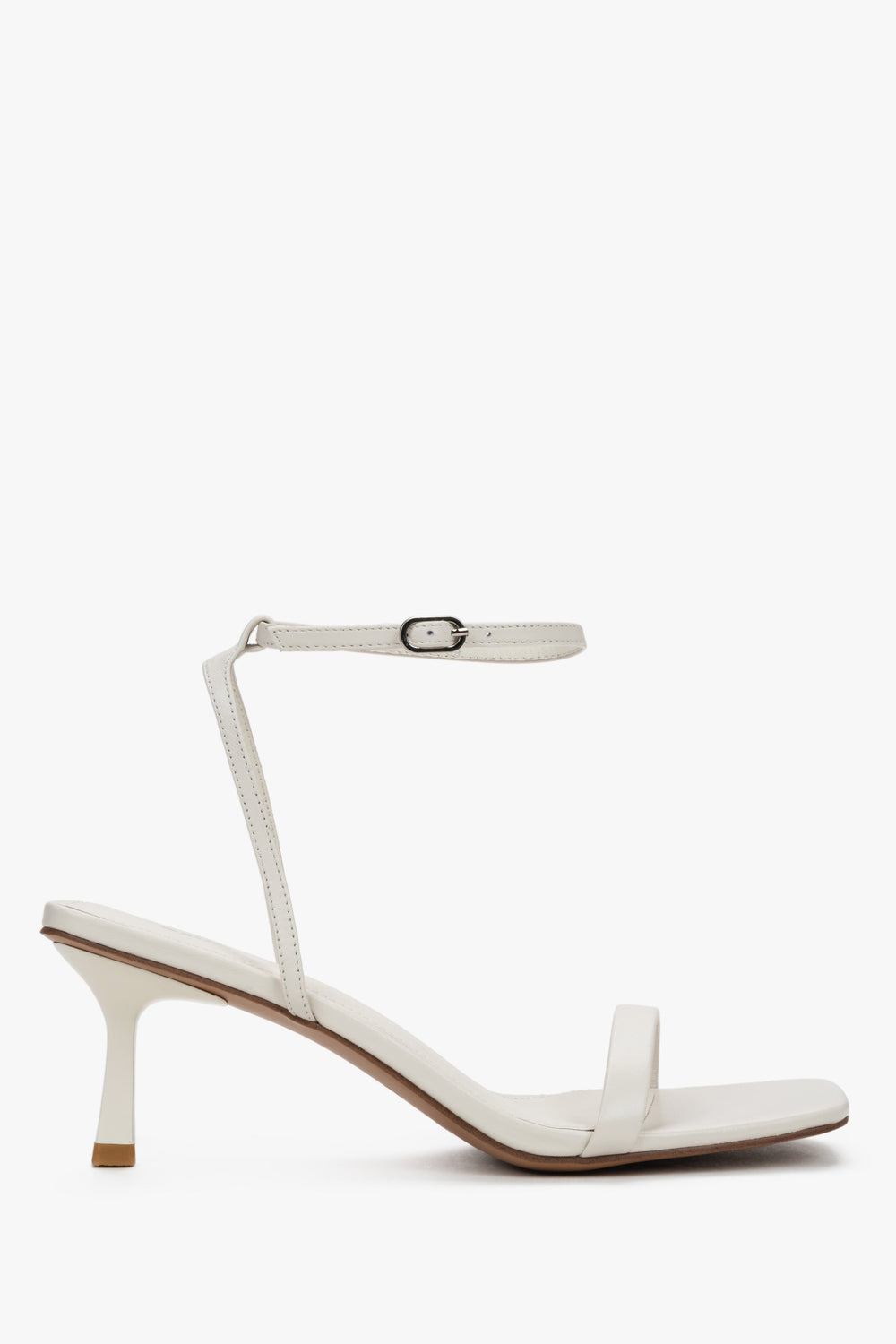 Women's beige leather funnel heel sandals by Estro with silver details.