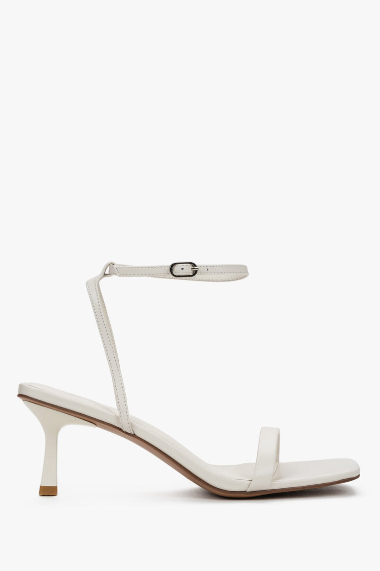 Women's beige leather funnel heel sandals by Estro with silver details.