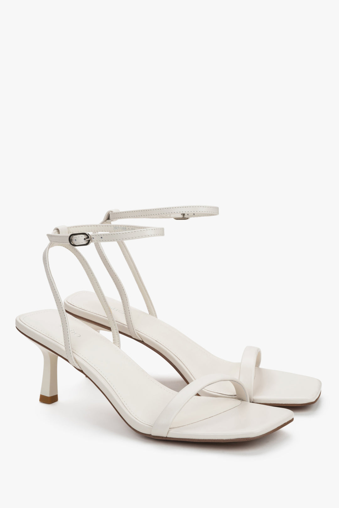 Side view of women's beige leather sandals with stable funnel heel.