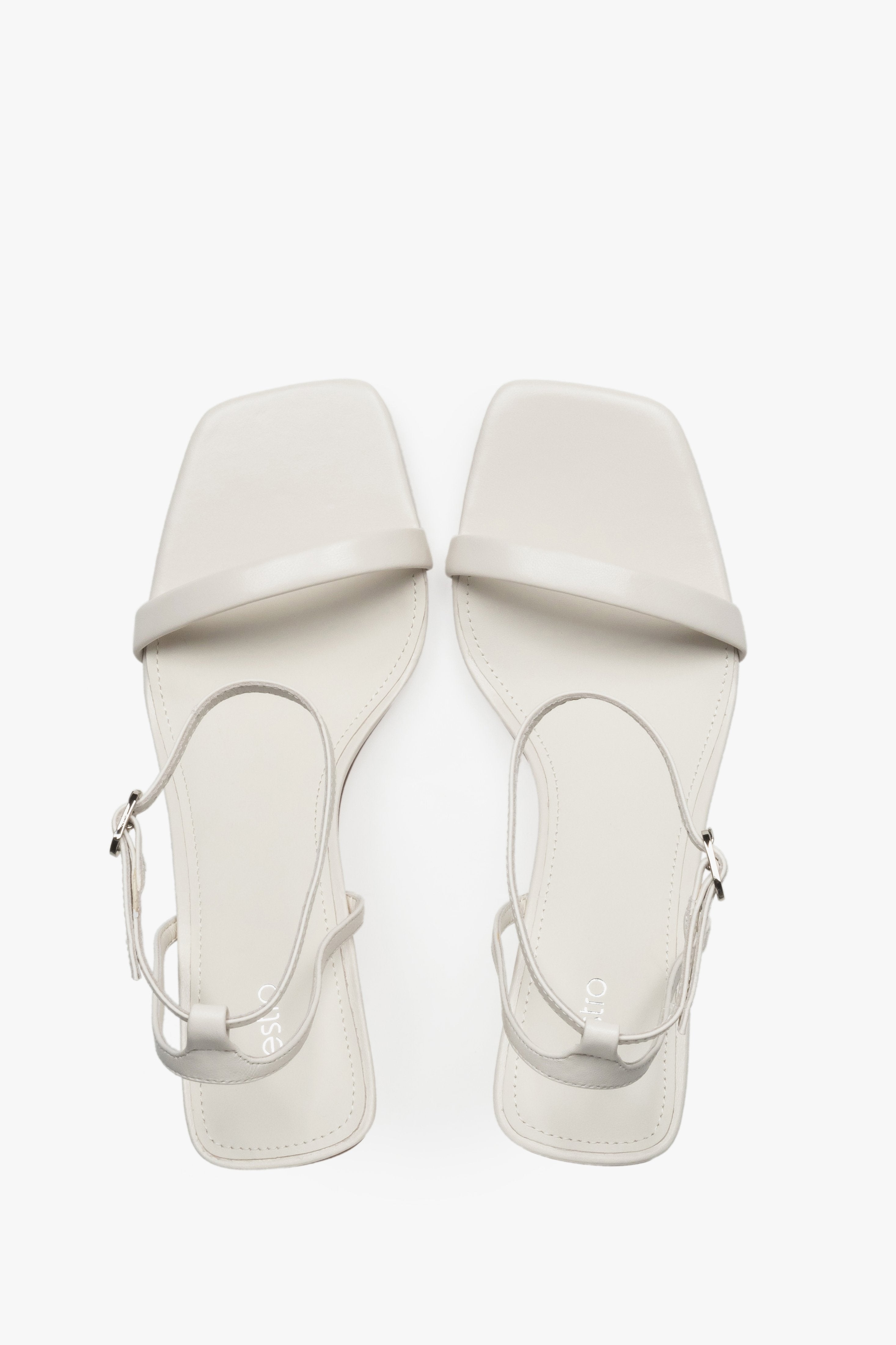 Top view of women's beige leather funnel heel sandals by Estro.