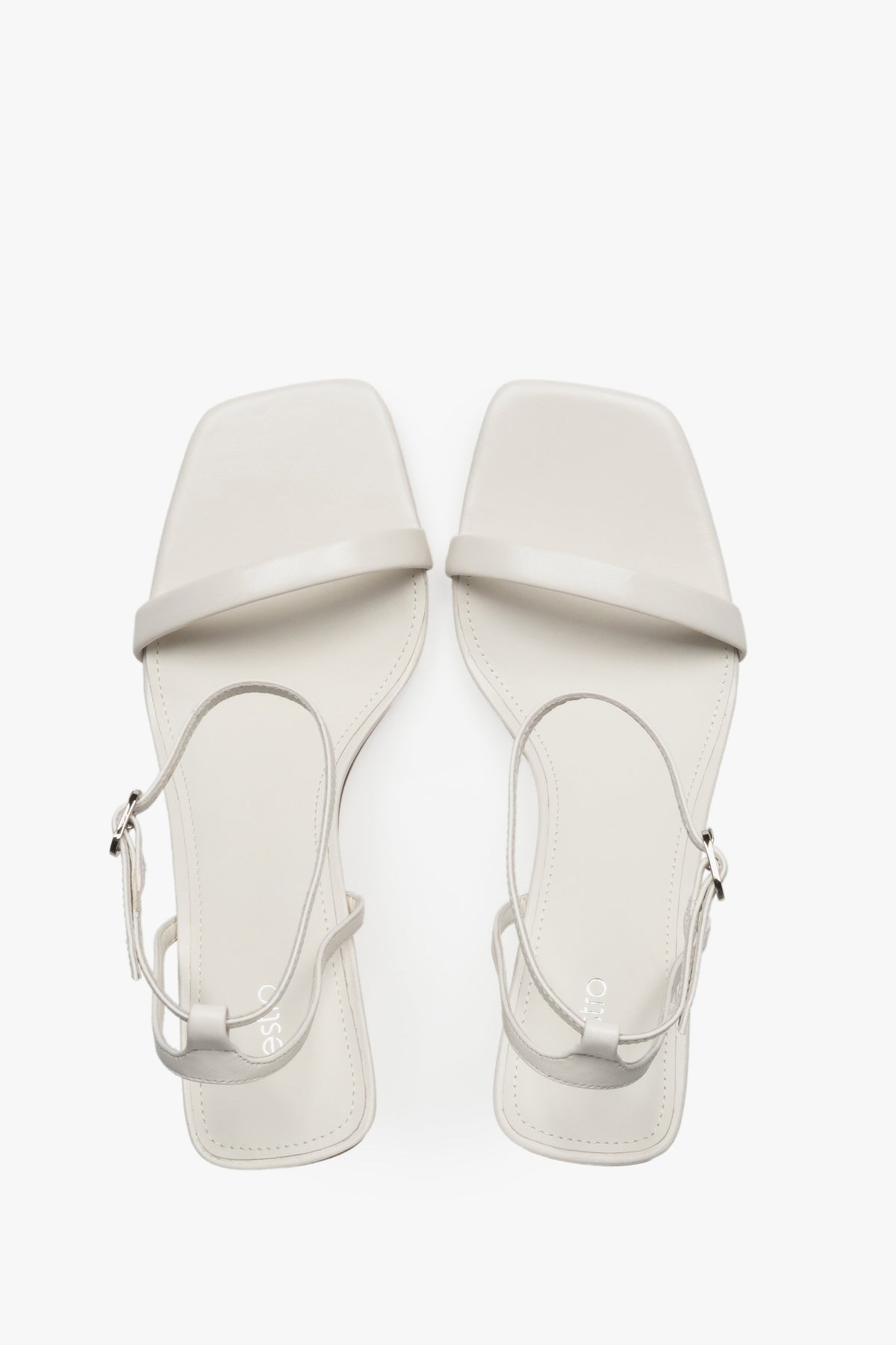 Top view of women's beige leather funnel heel sandals by Estro.