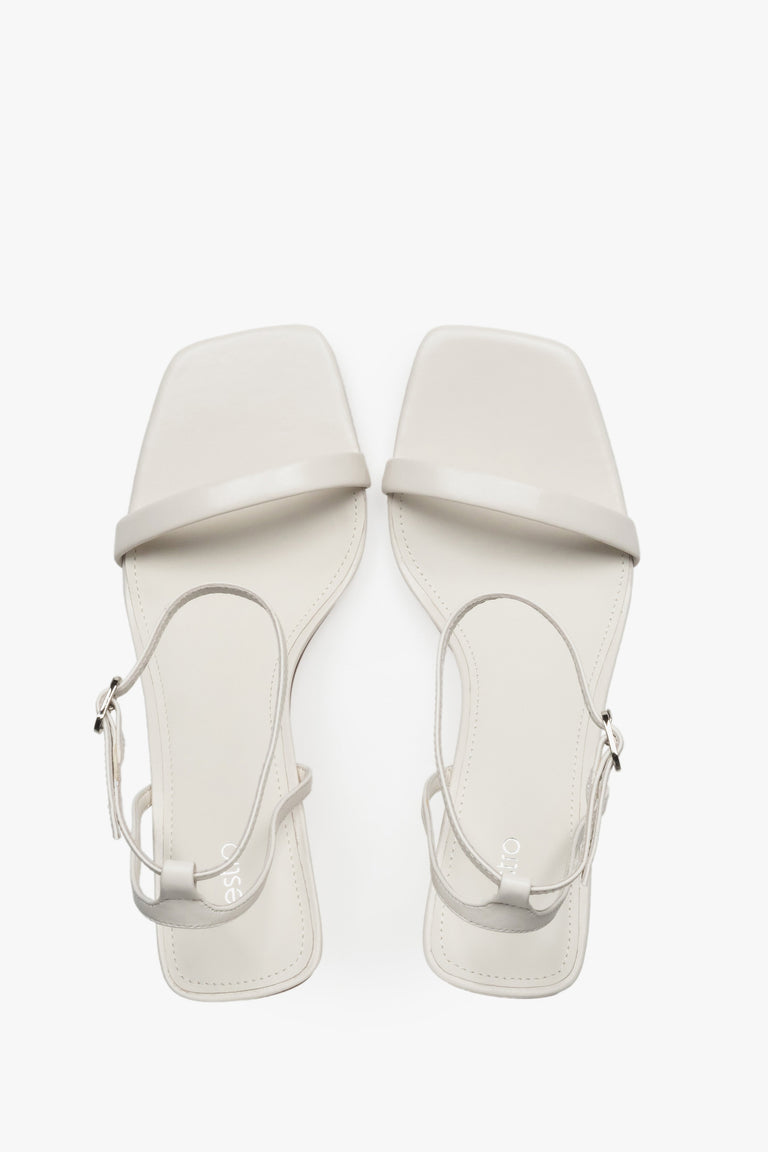 Top view of women's beige leather funnel heel sandals by Estro.